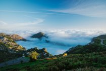 Wonderful view of blue sky above white thick clouds in valley from mountain — Stock Photo