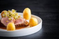 Duroc sirloin with orange ginger soy and potatoes — Stock Photo