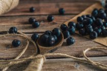Tasty bilberry on wooden surface — Stock Photo