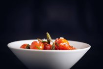 Fresh cherry tomatoes sauteed with green asparagus and rosemary — Stock Photo