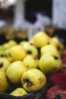 Stand full of ripe organic green apples at farmers outdoor market — Stock Photo