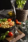 Homemade ravioli with basil and tomatoes — Stock Photo