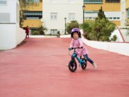 Little girl riding bicycles — Stock Photo