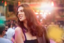 Long haired tender beautiful woman thoughtfully looking away in bright day in park at festival — Stock Photo