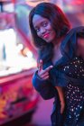 Cheerful black woman on funfair — Stock Photo