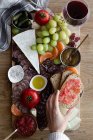 Top view of colorful fresh fruits meat vegetables and sauces for wine in hotel — Stock Photo