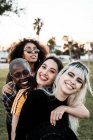 Multiethnic group of female hipsters cuddling with each one — Stock Photo