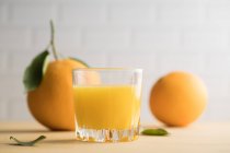 Orange juice in glass on the table — Stock Photo