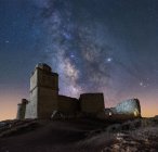 From below picturesque scenery of abandoned remains of ancient castle under Milky Way — Stock Photo
