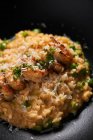 Tasty risotto with shrimps on plate — Stock Photo