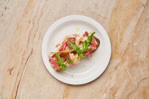 Open sandwich with ham and pear — Stock Photo