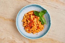 Tasty pasta with herbs and tomato — Stock Photo