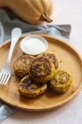 Delicious vegetable cutlets with sour cream on table — Stock Photo