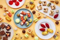 Various yummy desserts on plates — Stock Photo