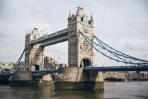 Sightseeing Tower Bridge in London with cloudy sky — Stock Photo