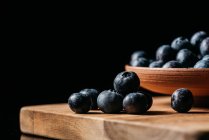 Fresh blueberries on wooden table — Stock Photo