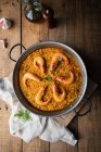 Metal pan of paella with roasted shrimps — Stock Photo