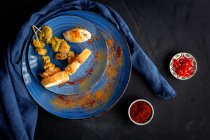 Homemade Moorish skewers with rice of meat with spices. Typical oriental food from above on dark background. Flat lay. Top view — Stock Photo