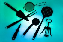 Composition of kitchen supplies on colorful background — Stock Photo