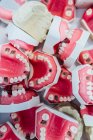 Box full of dental plaster models — Stock Photo