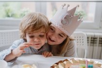 Happy brothers celebrating birthdays at home — Stock Photo