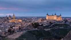 From above cityscape of aged town with medieval houses and castles during sunset — Stock Photo
