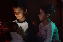 Cute brothers watching cartoon on tablet together — Stock Photo