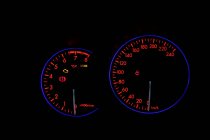 Car instrument panel with neon illumination on digital display with indicators and information about speed — Stock Photo