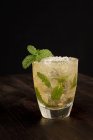 Closeup of a mojito with lots of ice on a table — Stock Photo
