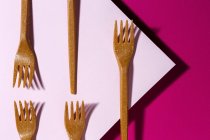 From above view of brown eco friendly fork on pink carton background — Stock Photo