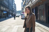 Beautiful blond young girl walking around Chinese downtown — Stock Photo