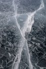 Top view ice abstract pattern of frozen Lake Baikal on cloudy winter day — Stock Photo