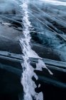 Top view ice abstract pattern of frozen Lake Baikal on cloudy winter day — Stock Photo