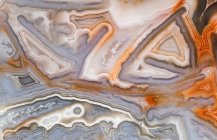 Macro photograph of the chaotic structure in a Crazy Lace agate from Mexico — Stock Photo