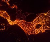 From above the magma of the volcano runs in the form of rivers of lava across the ground in Iceland — Stock Photo