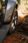 View of an off-road car wheel on a road on a sunny day — Stock Photo
