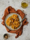 From above of delicious pumpkin noodles with seeds served on plate of table for lunch — Stock Photo