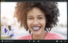 Crop cheerful African American female patient with braces smiling at camera while talking with male doctor waving hand during video chat — Stock Photo