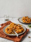 From above of delicious pumpkin noodles with seeds served on plate of table for lunch — Stock Photo