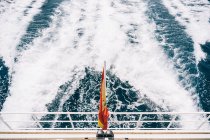 From above of white splashing swirls on sea water surface from sailing cruise ship — Stock Photo