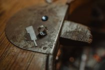 Detail of Ring at workshop next to a gem — Stock Photo