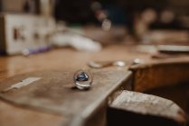 Detail of Ring at workshop next to a gem — Stock Photo
