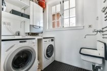Luxury interior design of a laundry room with marble walls — Stock Photo