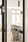 View from the door to a dining room with stylish furniture — Stock Photo