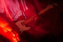 Blurred scene of musicians performing rock music con stage — Stock Photo