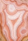 Macro of abstract background of agate gemstone with white and red spots and lines in lagoon in Mexico — Stock Photo