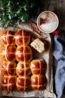 Crop freshly baked hot cross buns on baking tray — Stock Photo