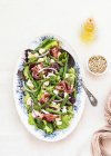From above delicious prosciutto, mozzarella and asparagus salad on white table background — Stock Photo