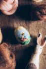 Hand made easter eggs made of wool and felt on dark wooden table — Stock Photo