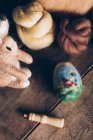 Hand made easter eggs made of wool and felt on dark wooden table — Stock Photo